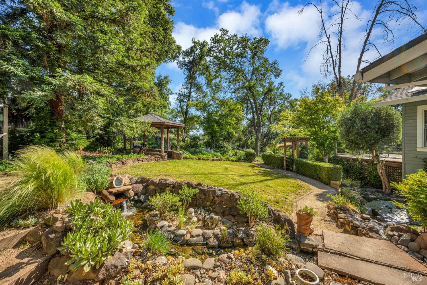 a view of a yard with swimming pool