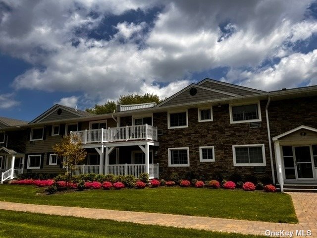 a front view of building with yard