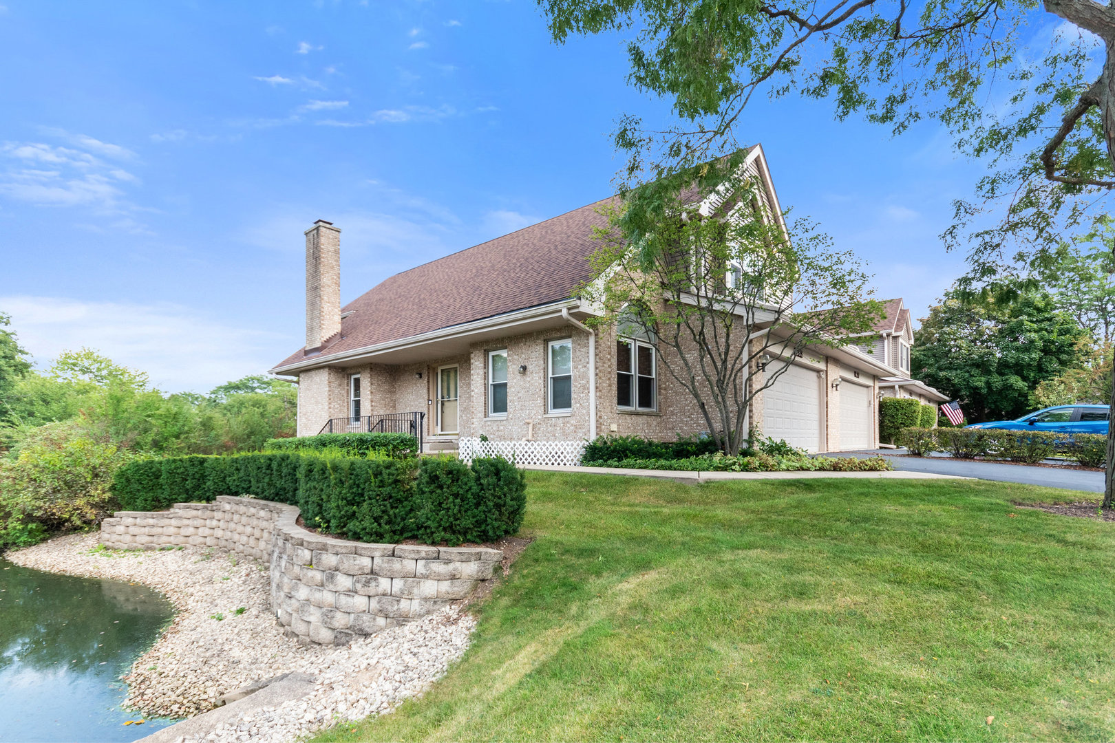 a front view of a house with a garden