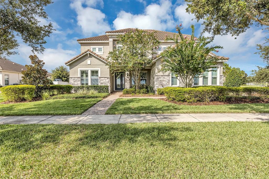 a front view of a house with a yard