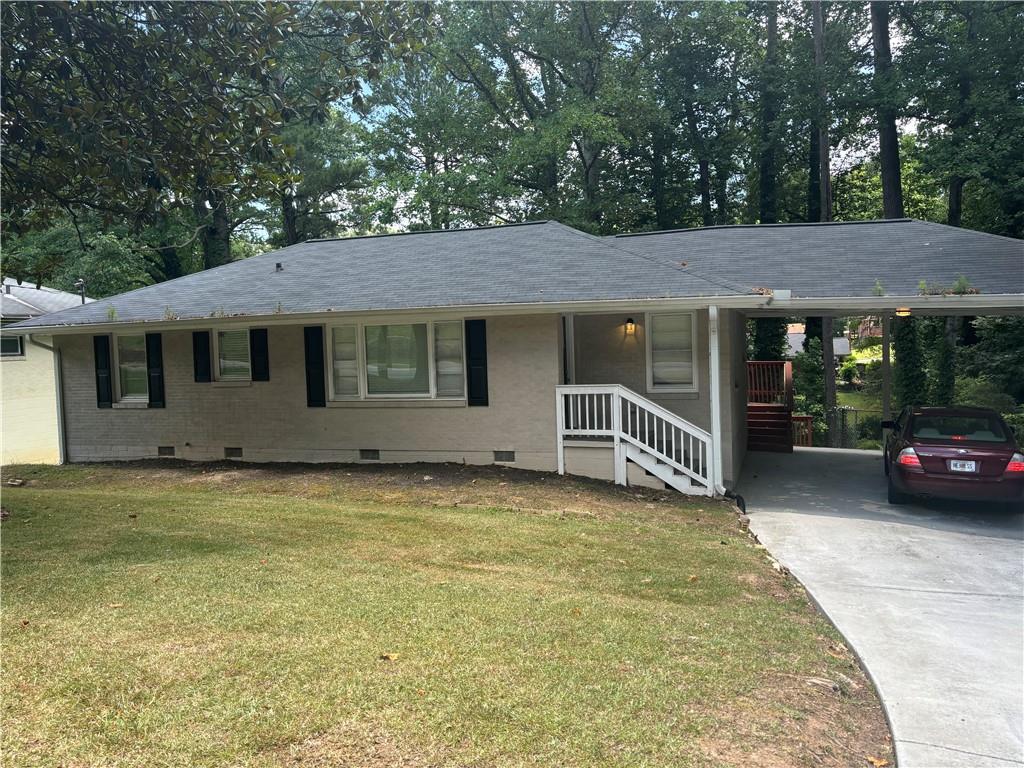 a view of a house with a garden and yard