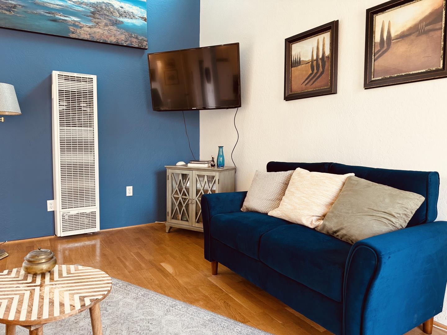 a bedroom with a bed and wall painting