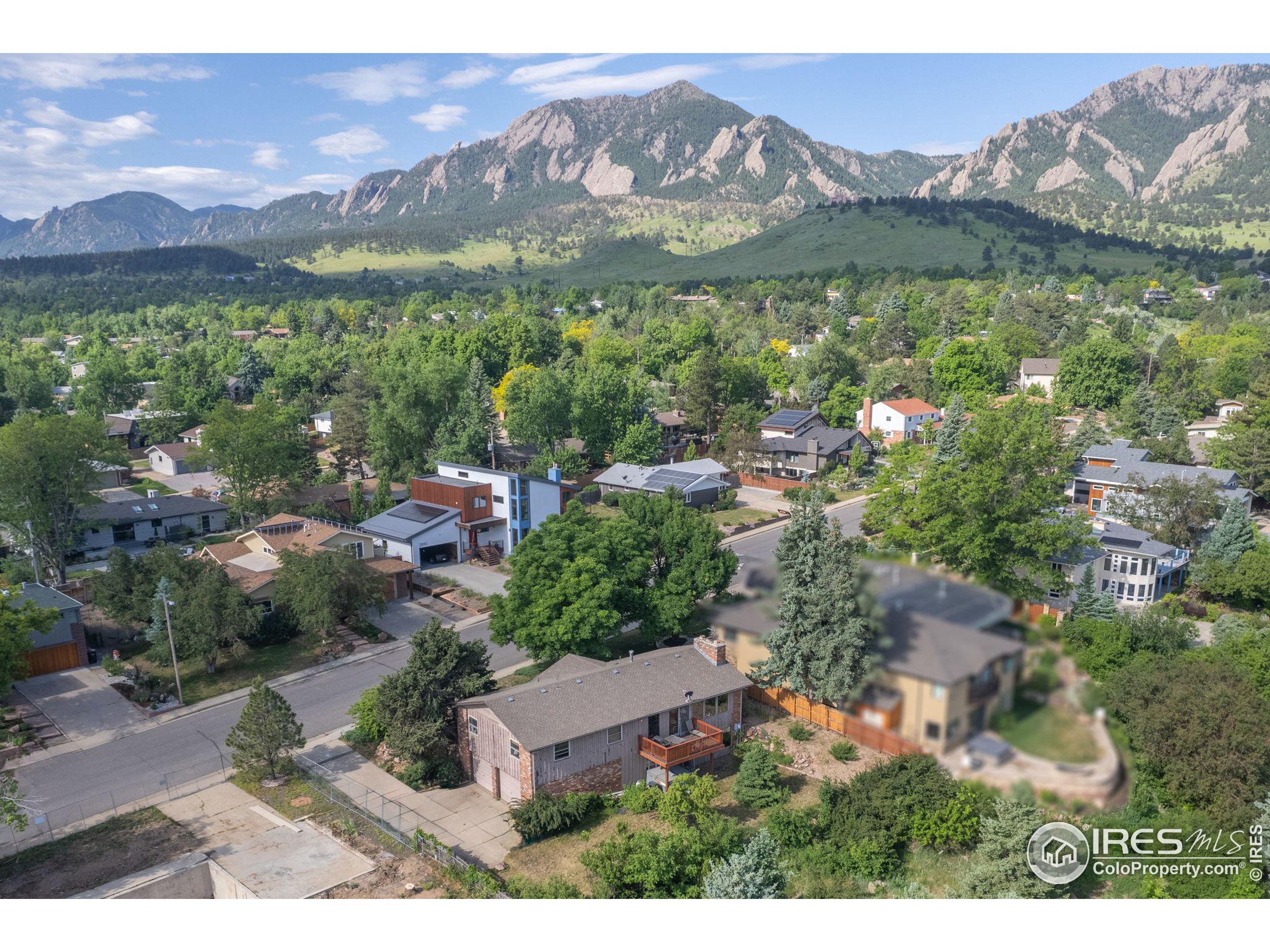 an aerial view of residential house with outdoor space and mountain view