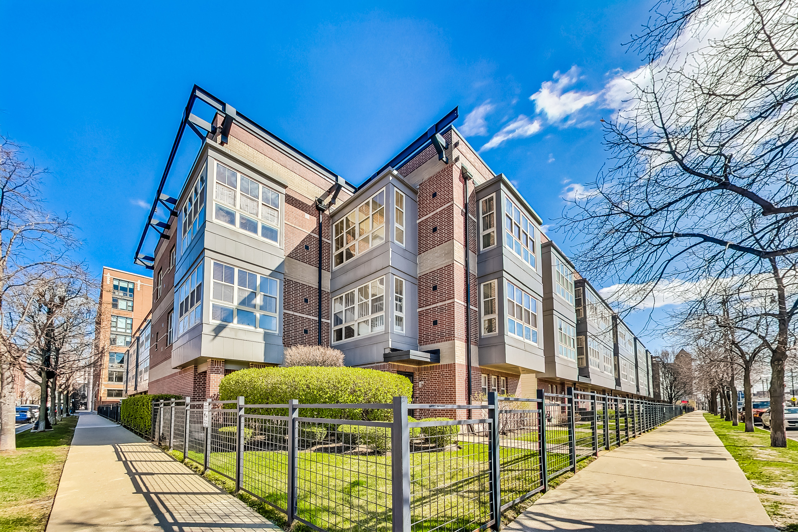 a view of a brick building with many windows