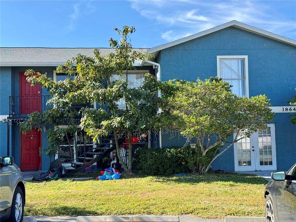 a view of a house with a yard