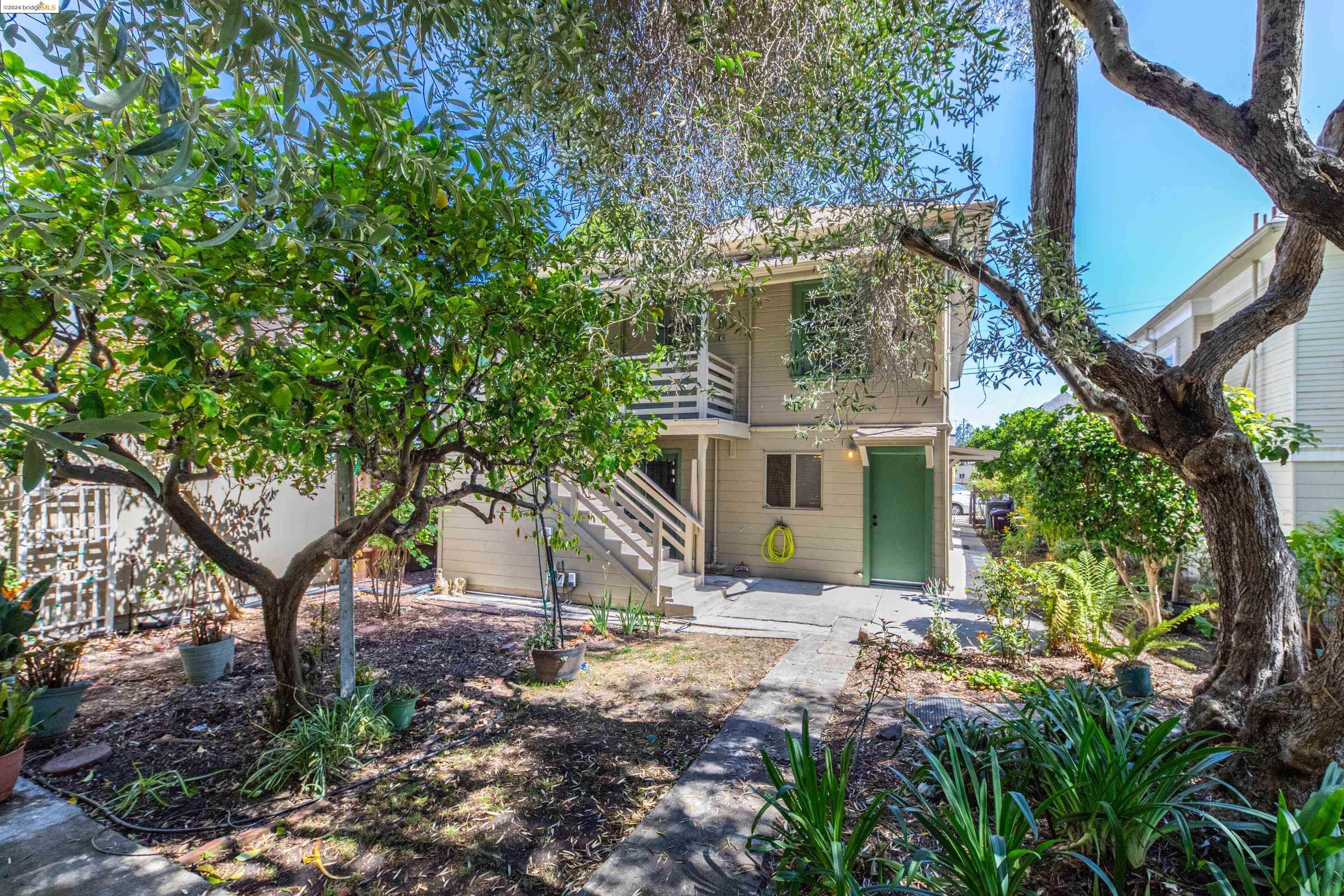 a view of a house with a tree