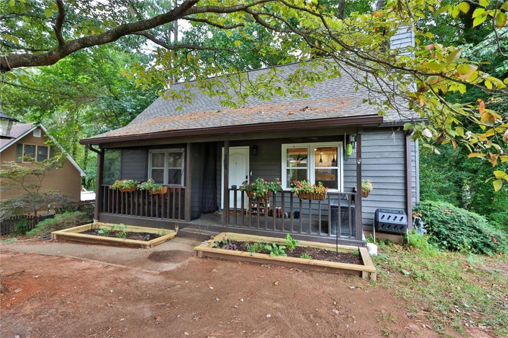 a view of house with outdoor seating area