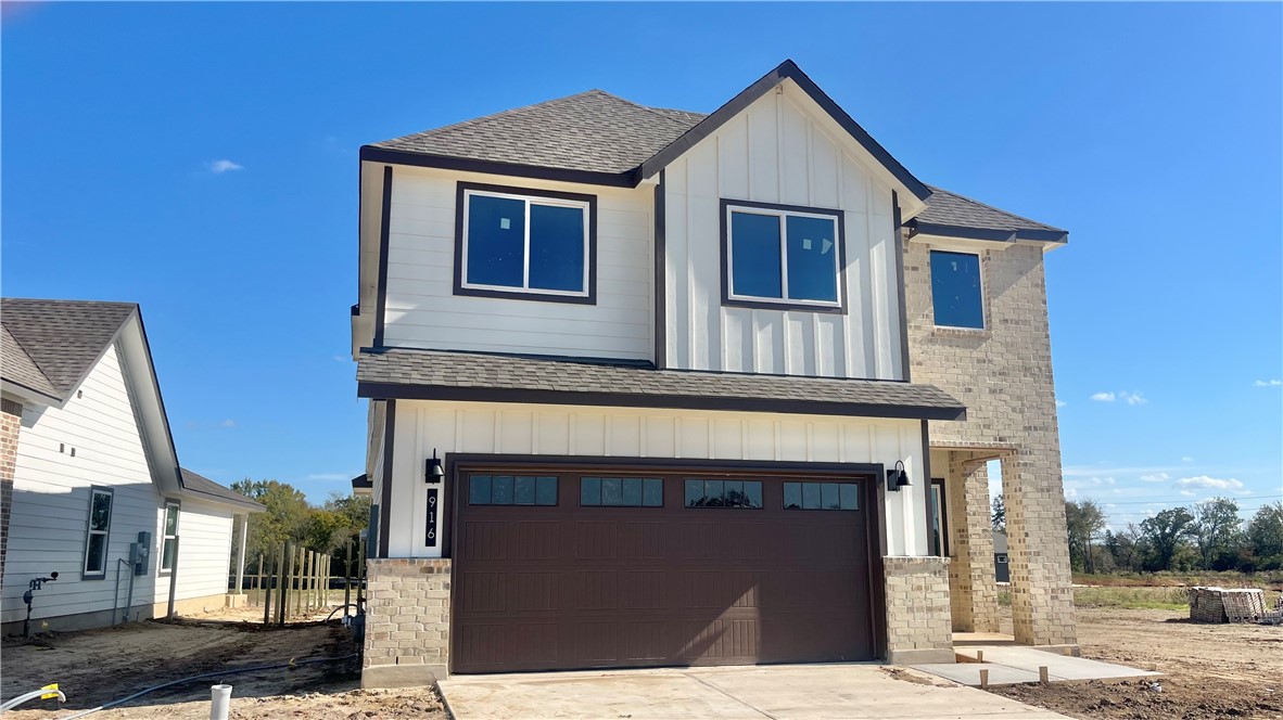 View of front of home featuring a garage