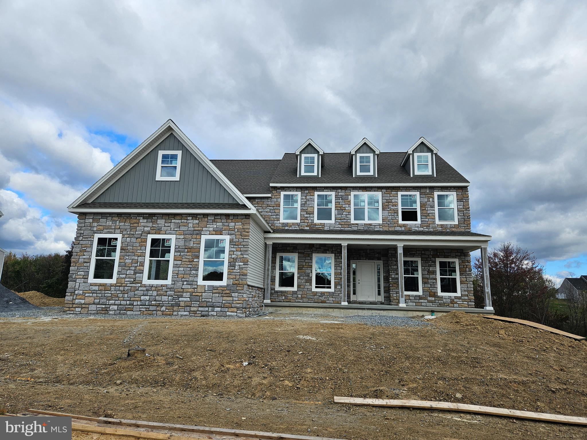 a front view of a house with yard