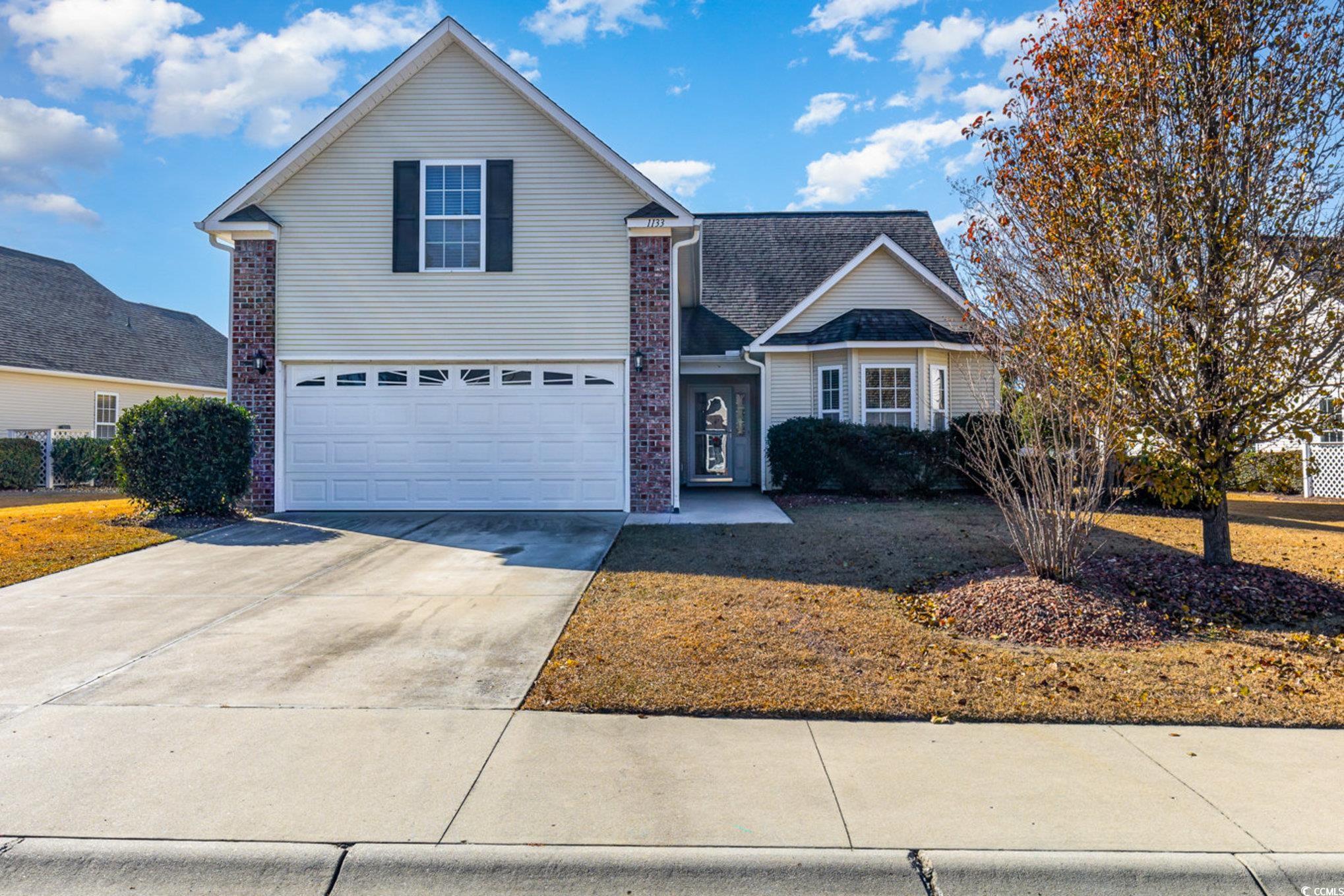 View of front property with a garage