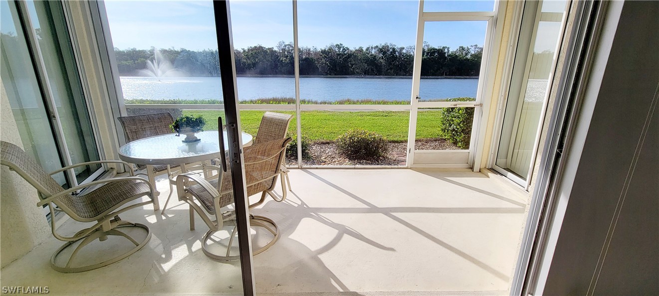 a view of a room with a floor to ceiling window and an outdoor space