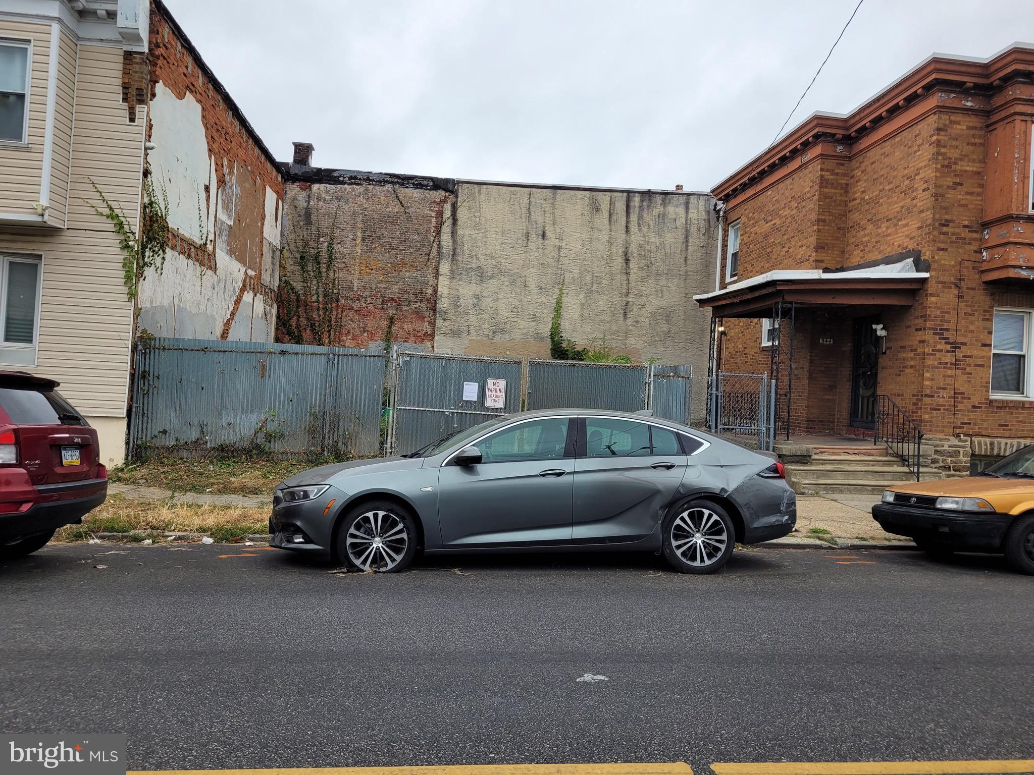 a view of a car parked in front of a house