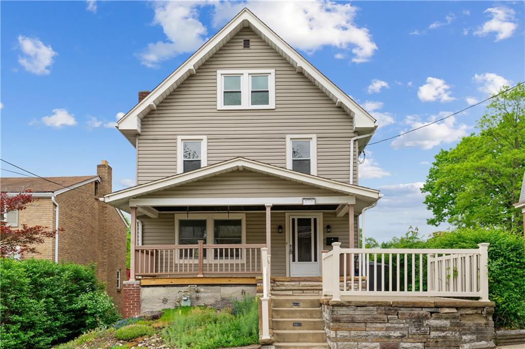 a front view of a house with a porch