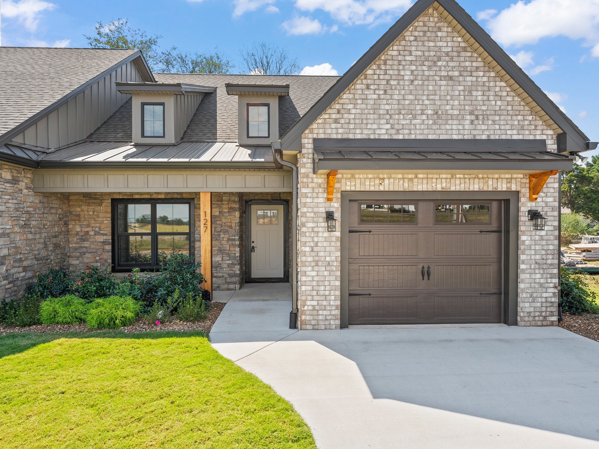 front view of a house with a yard