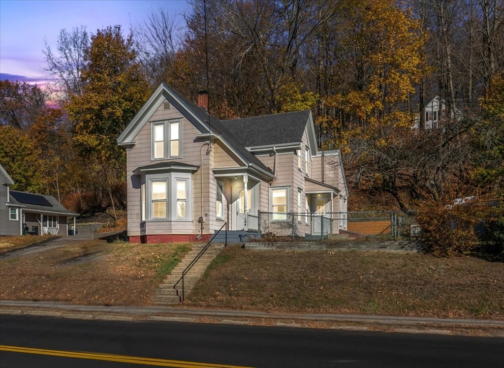 a front view of a house with a yard