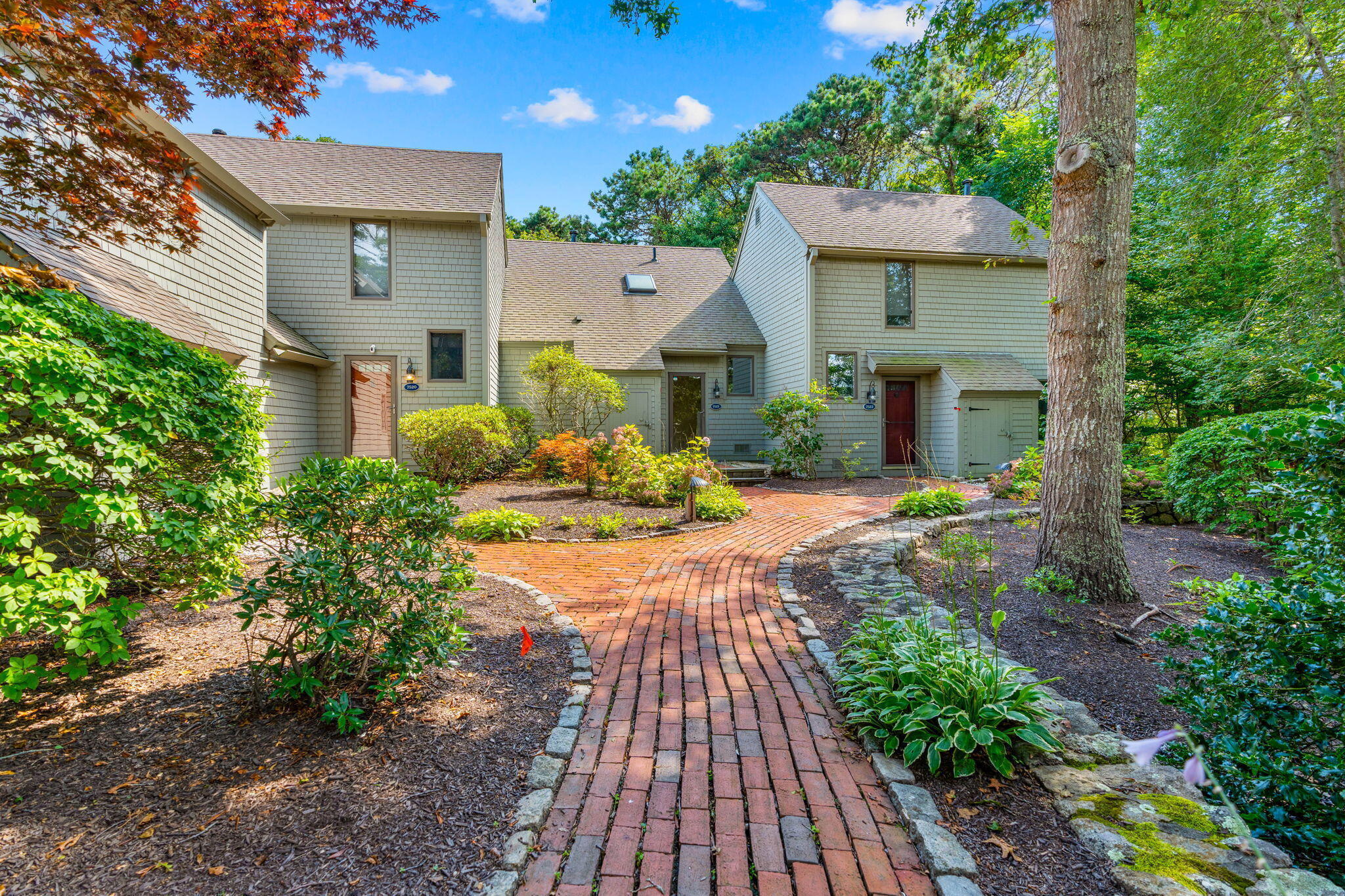 a front view of a house with a yard