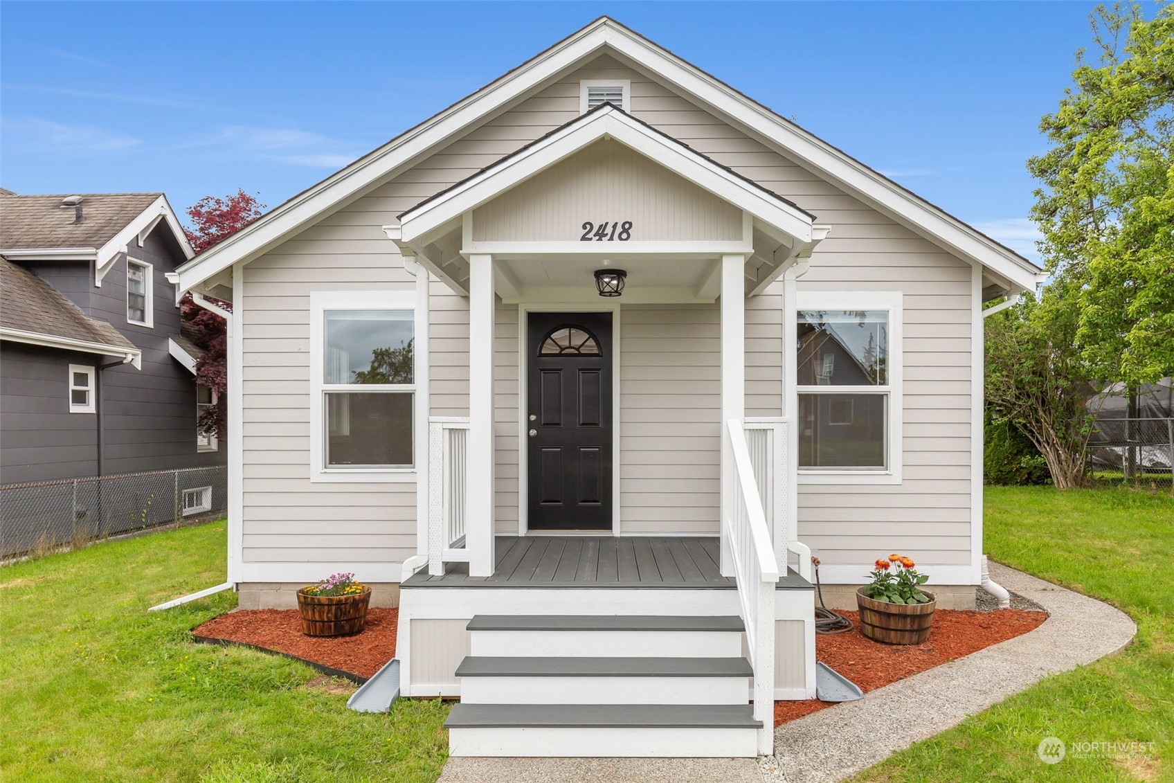 a front view of a house with a yard