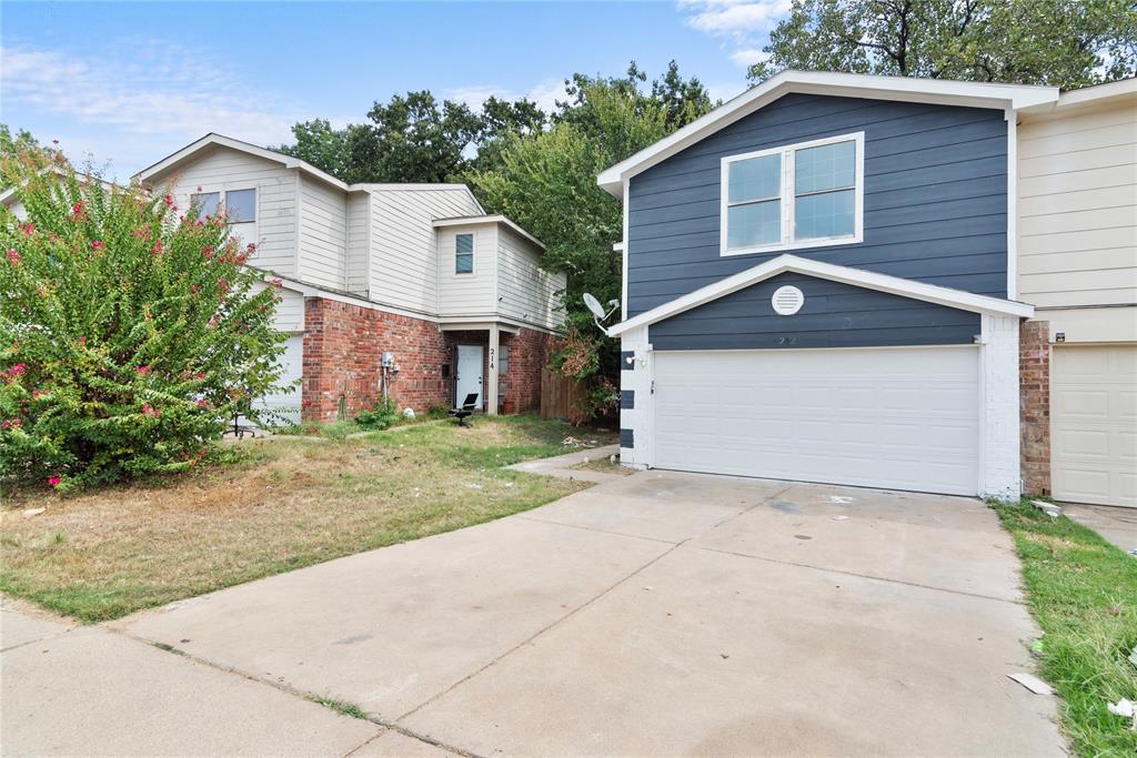 a view of backyard of house with garage