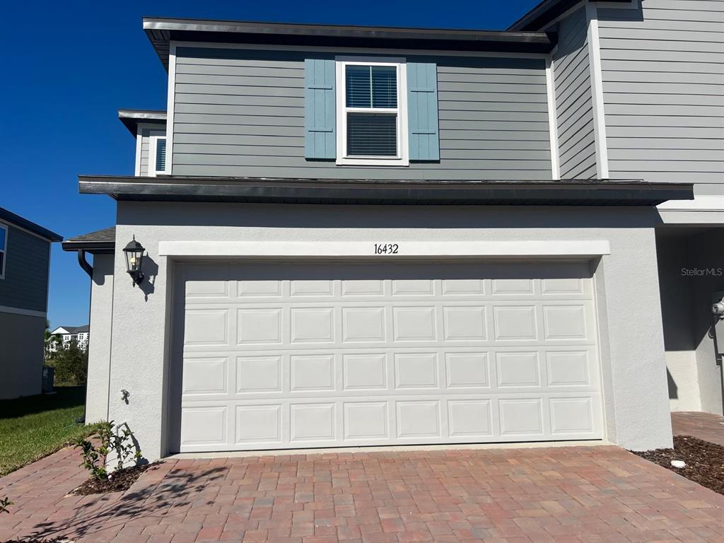 a front view of a house with a garage