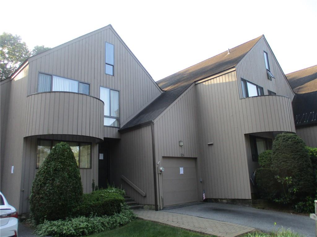 View of front facade featuring a garage