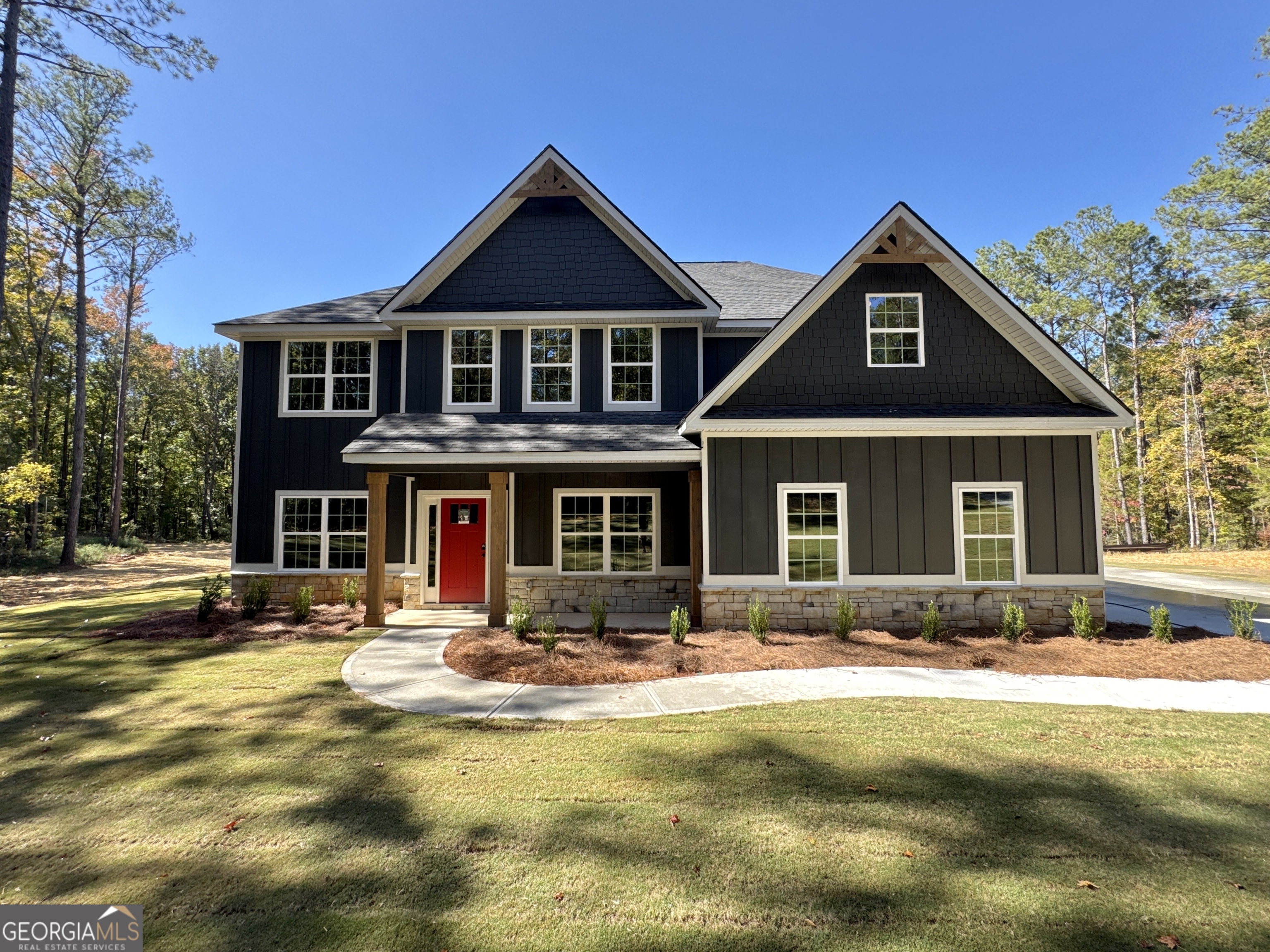 a front view of a house with a yard