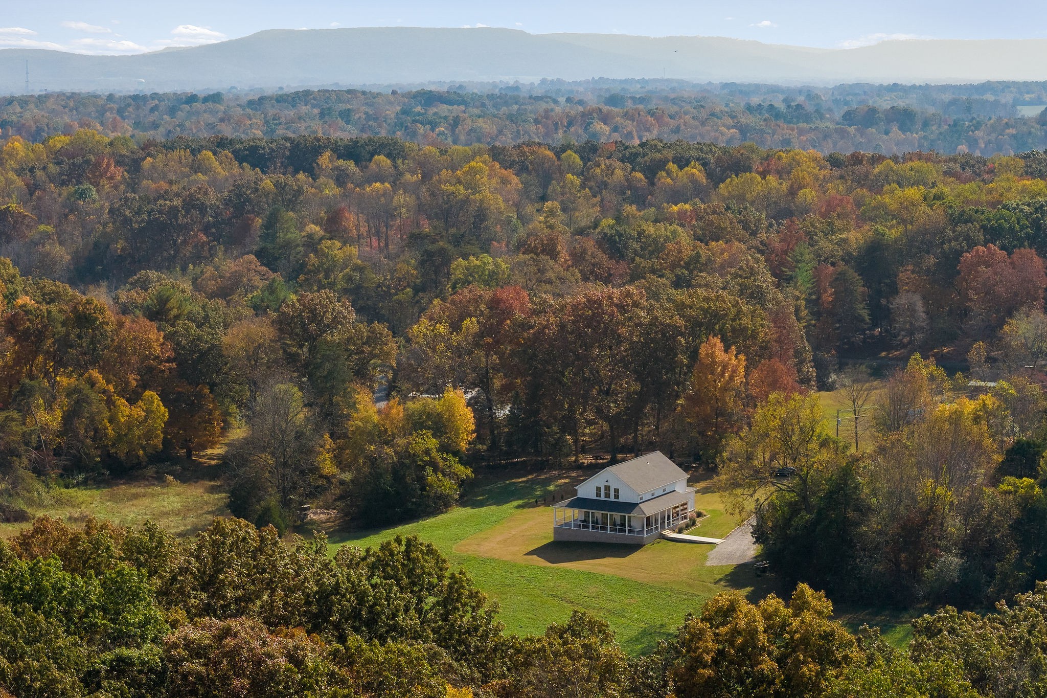 Stunning 4 BR/3.5 bath custom farmhouse with almost 13 acres!