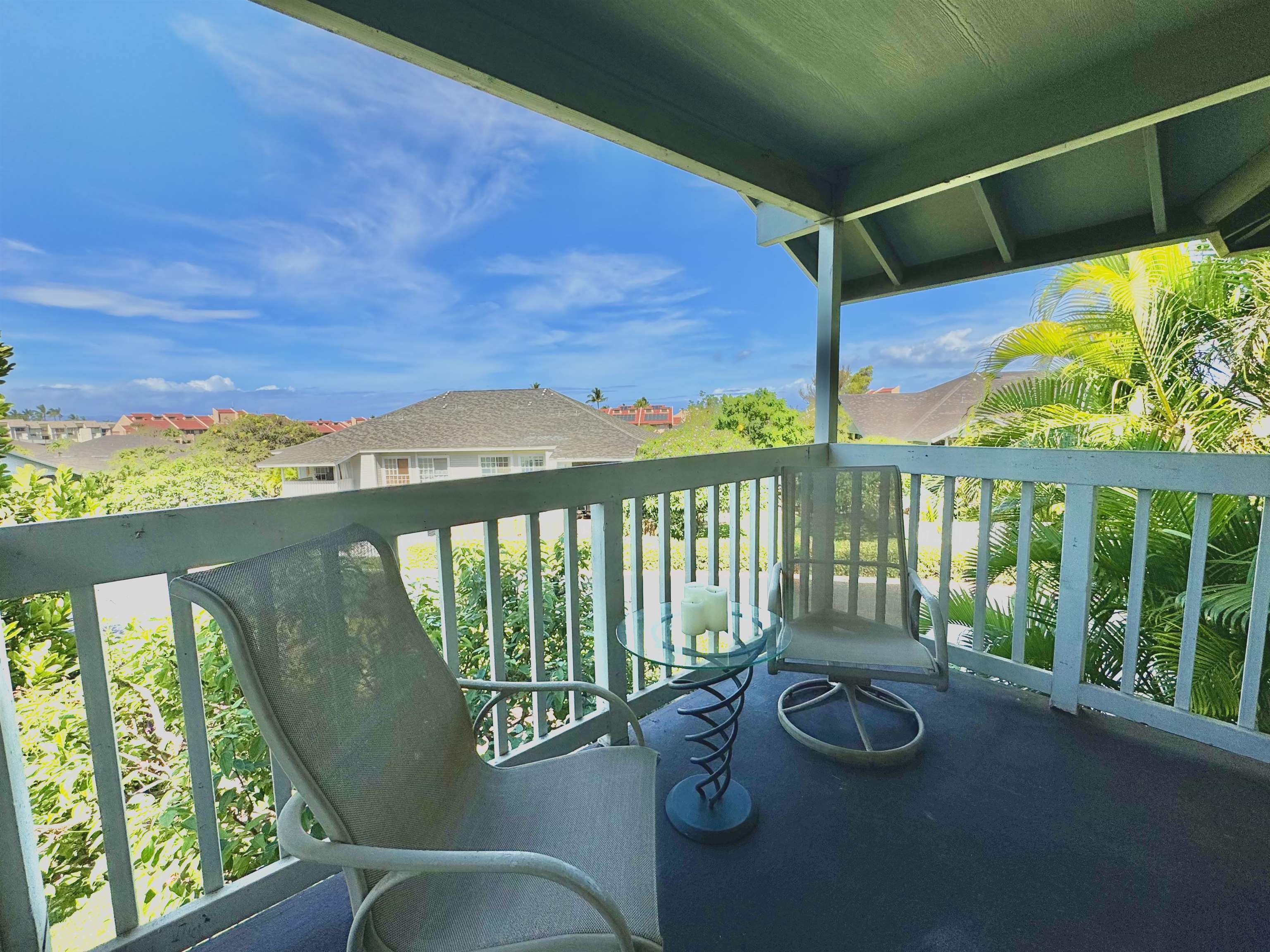 a view of a chairs and table in patio