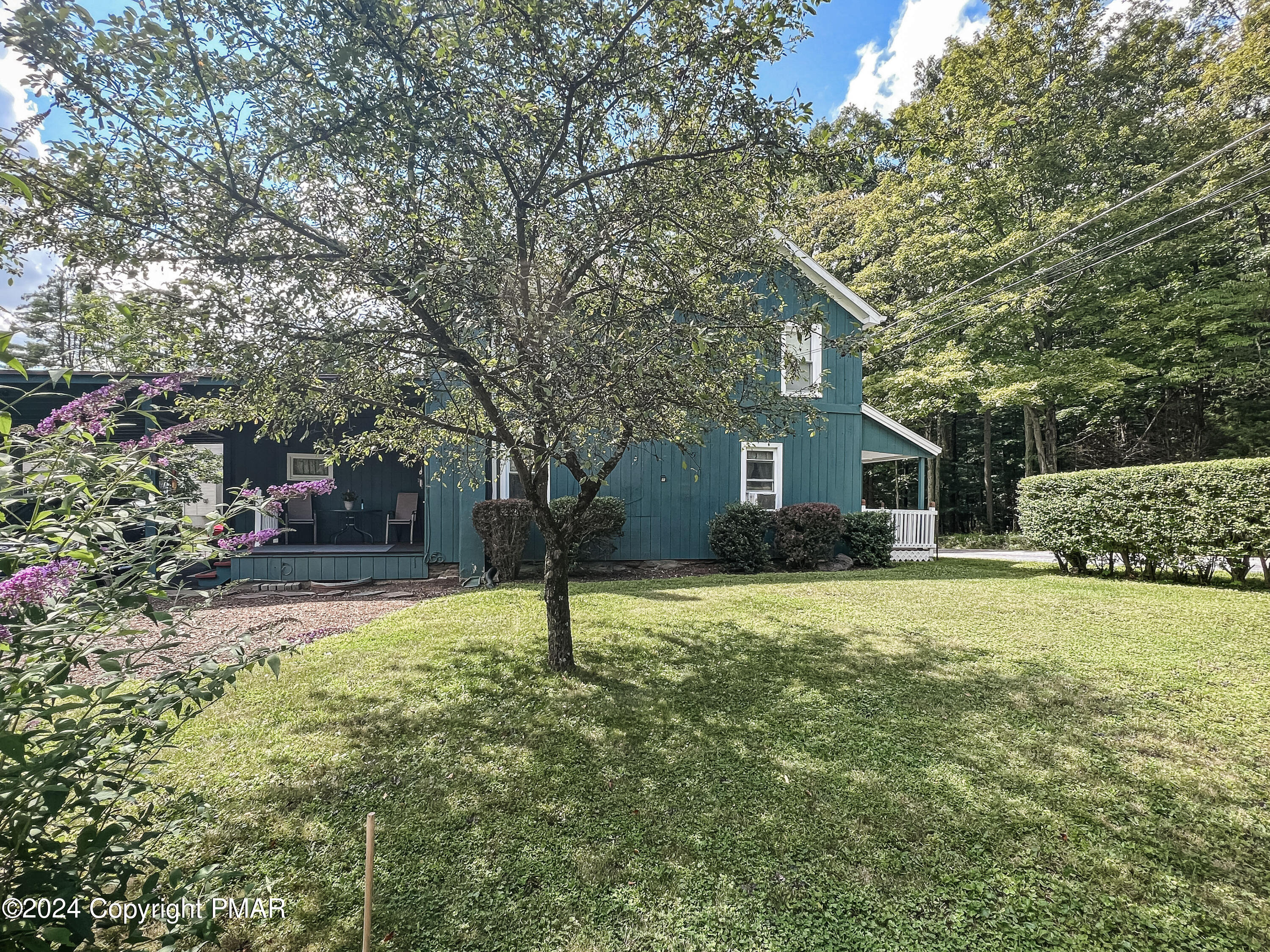 a house with a tree in front of it