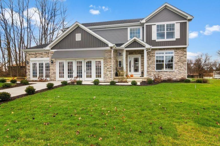 a front view of a house with a yard