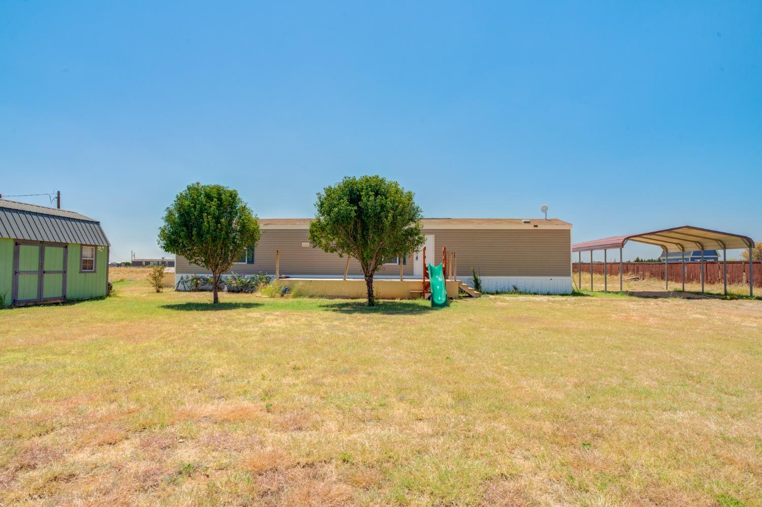 a view of a swimming pool and an outdoor space