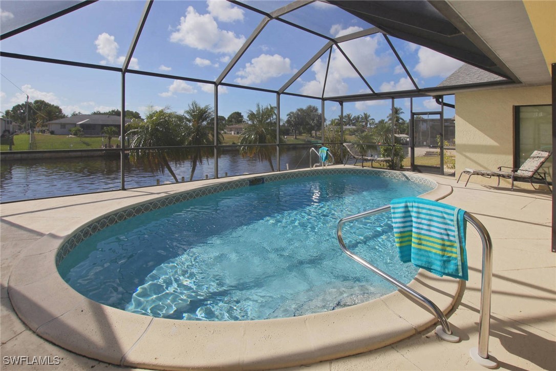 a view of a swimming pool with a patio