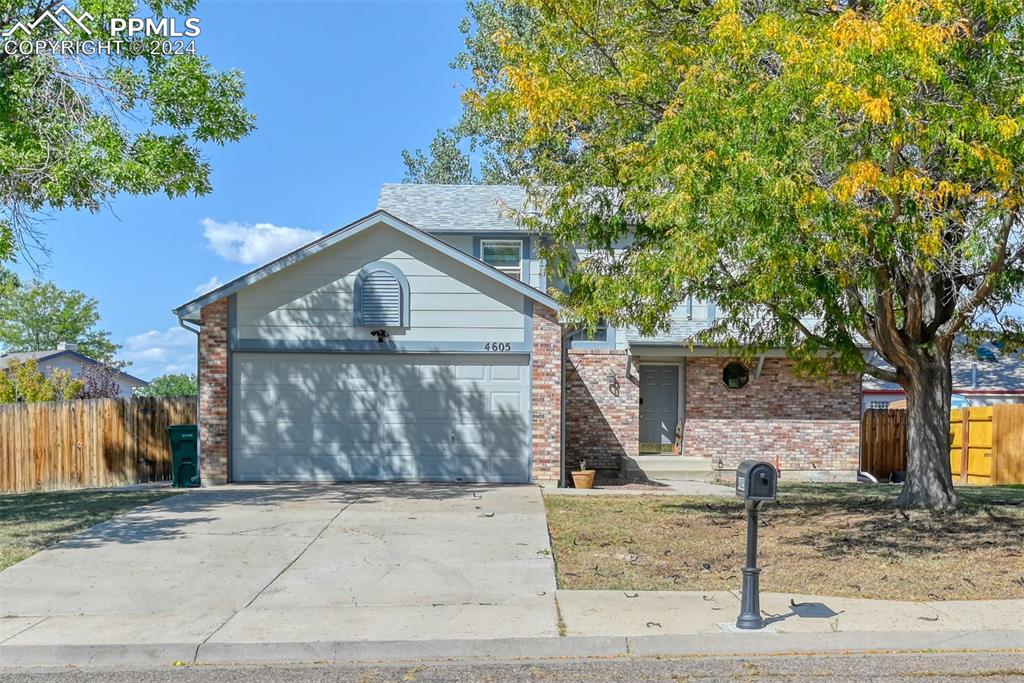 View of front of property with a garage