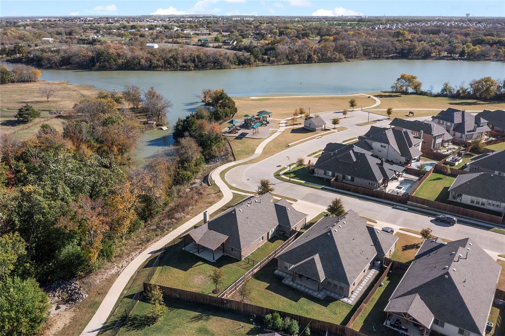 an aerial view of a house with a lake view