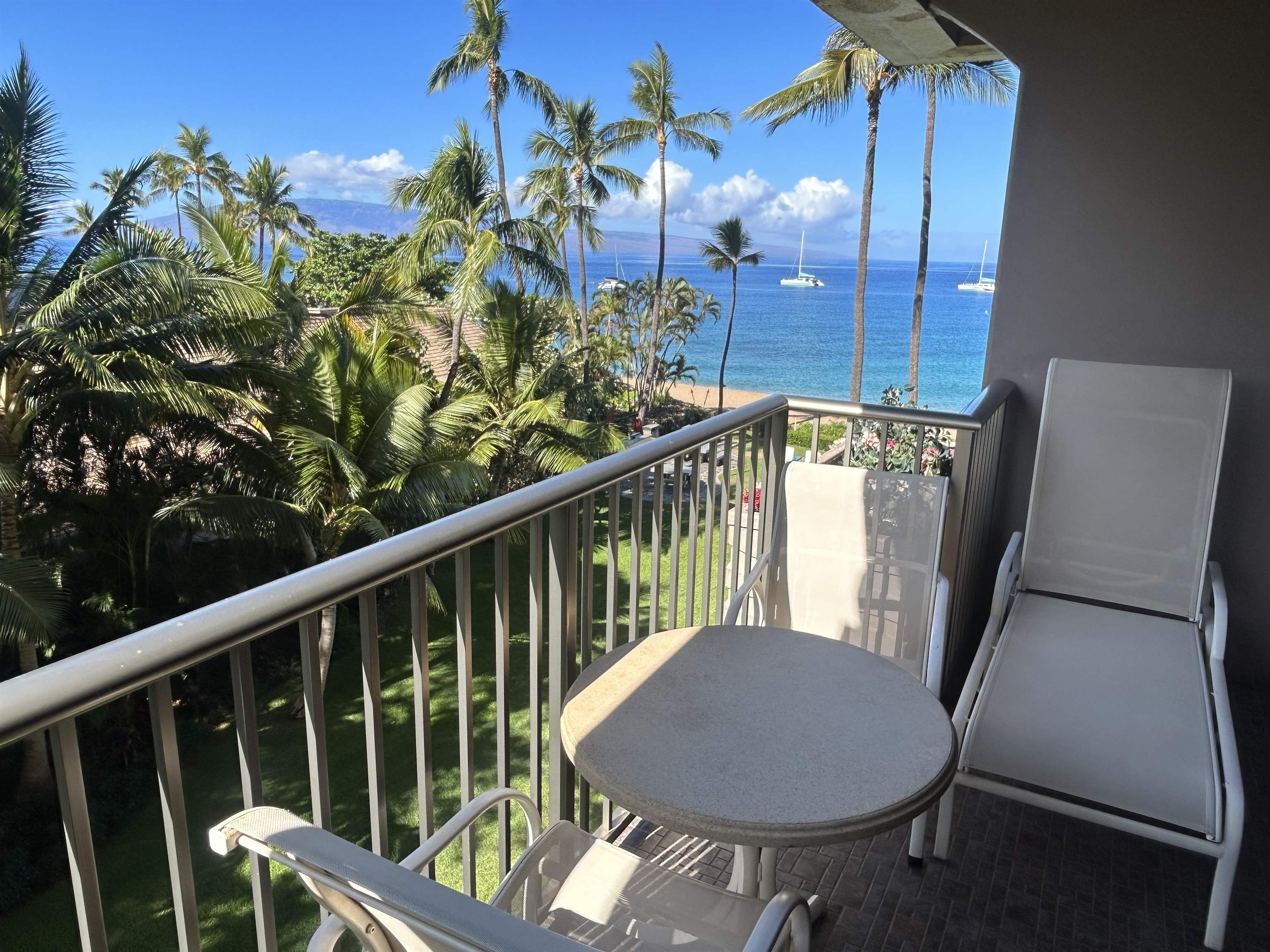 a view of a balcony with chairs