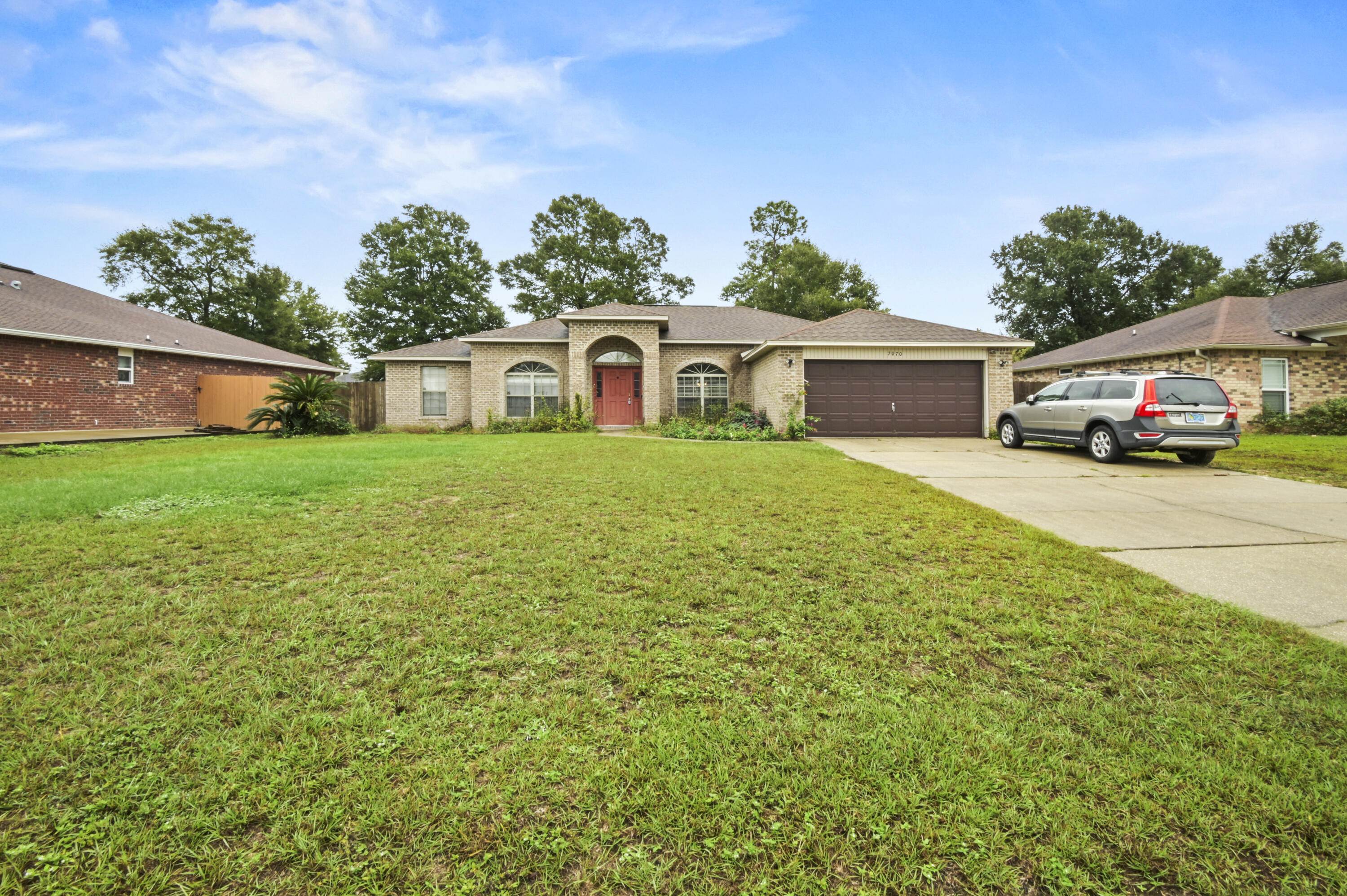 front view of a house with a yard