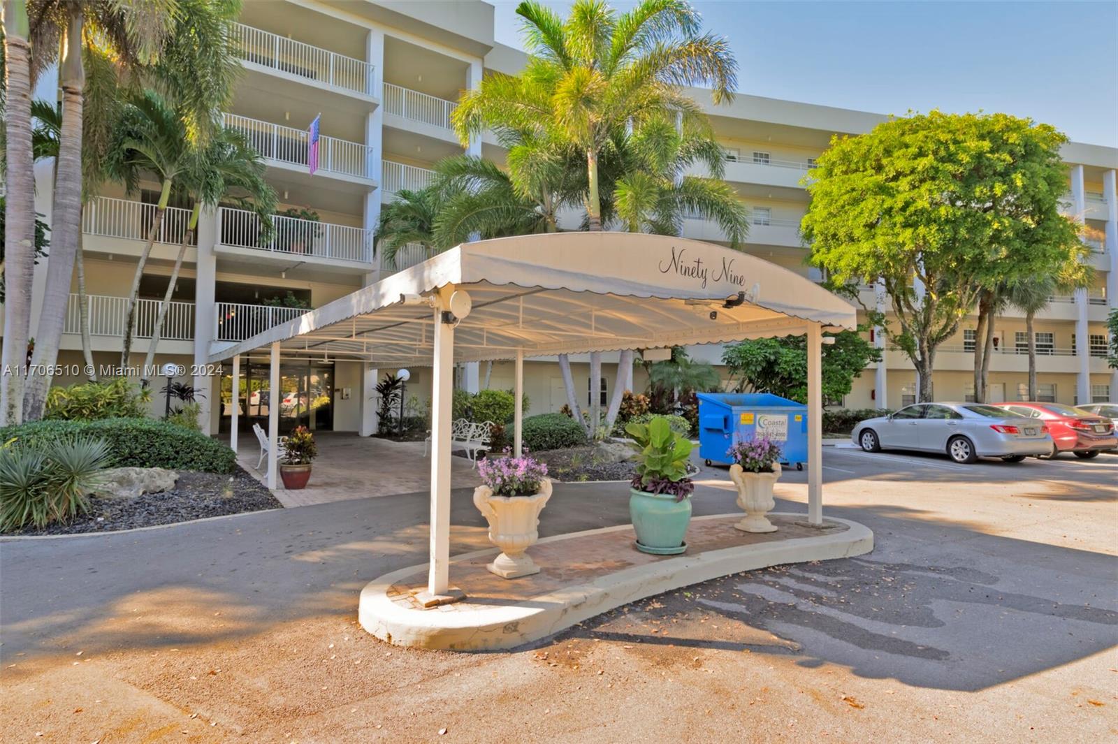 a view of a patio with a table and chairs under an umbrella