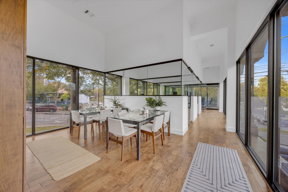 a dining room with furniture wooden floor and a rug