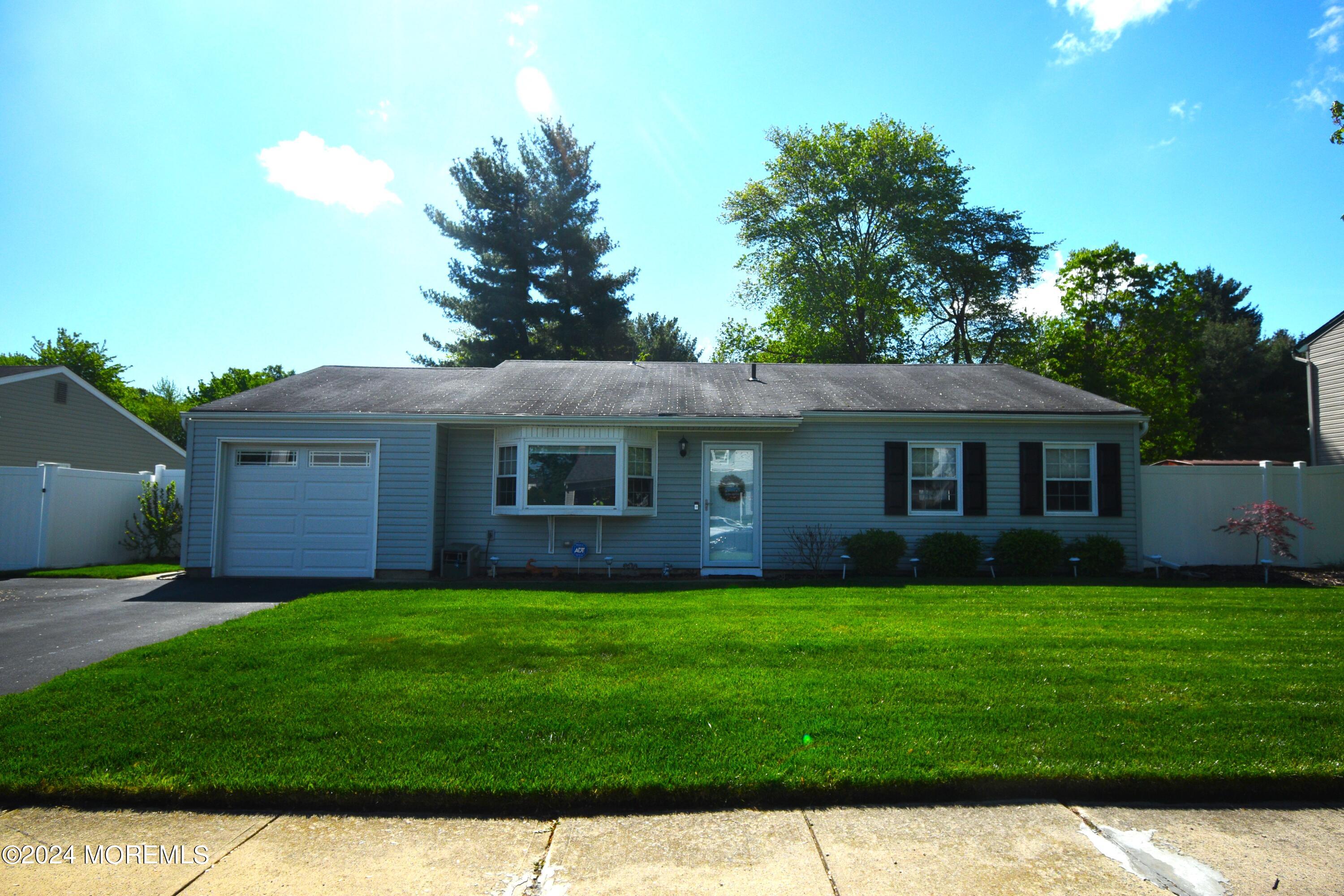 a view of a yard in front of a house