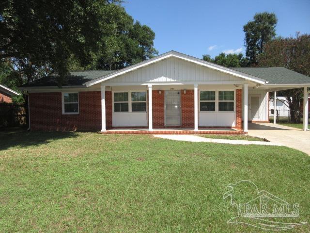 front view of a house with a yard