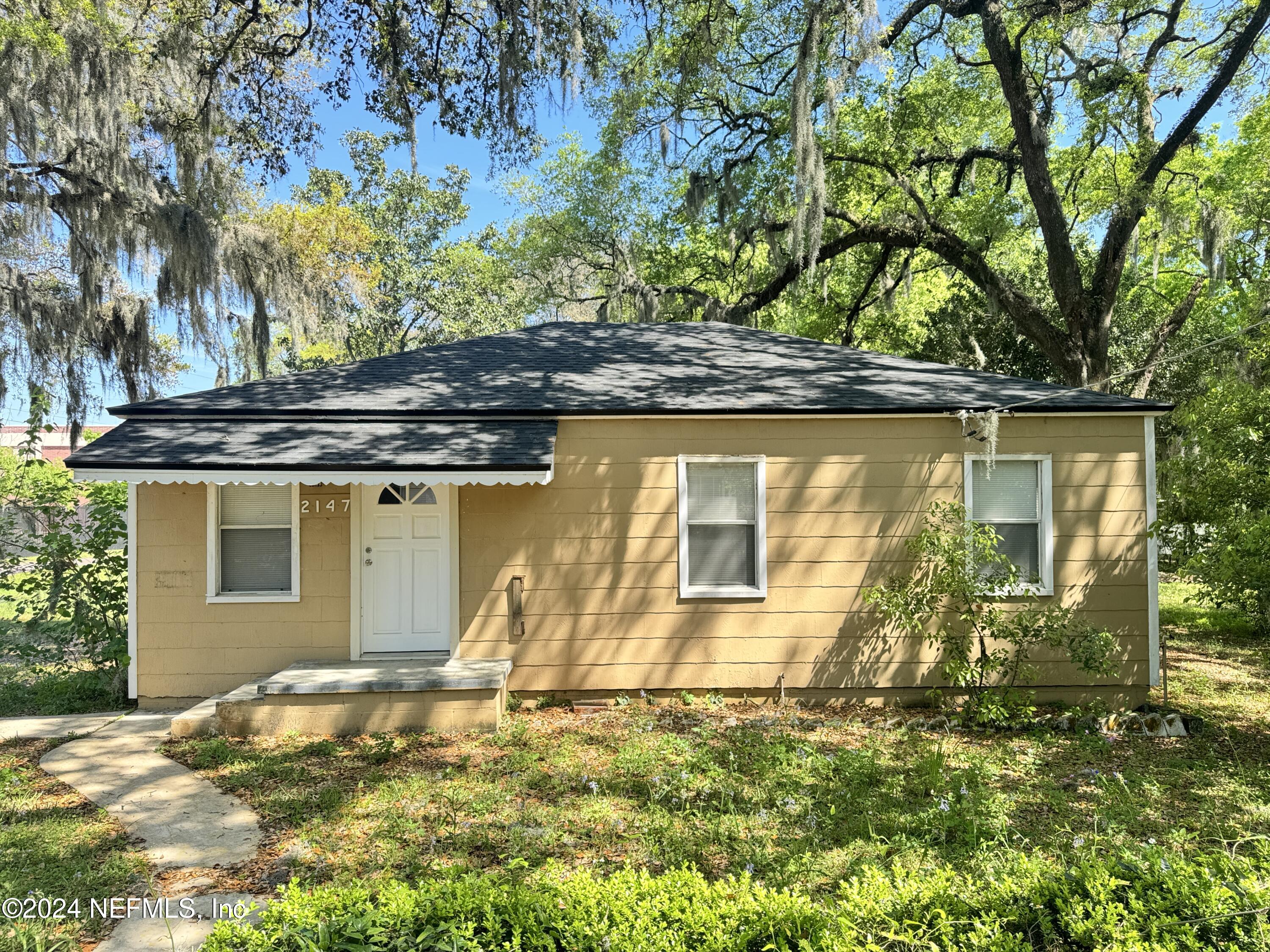 front view of a house with a yard