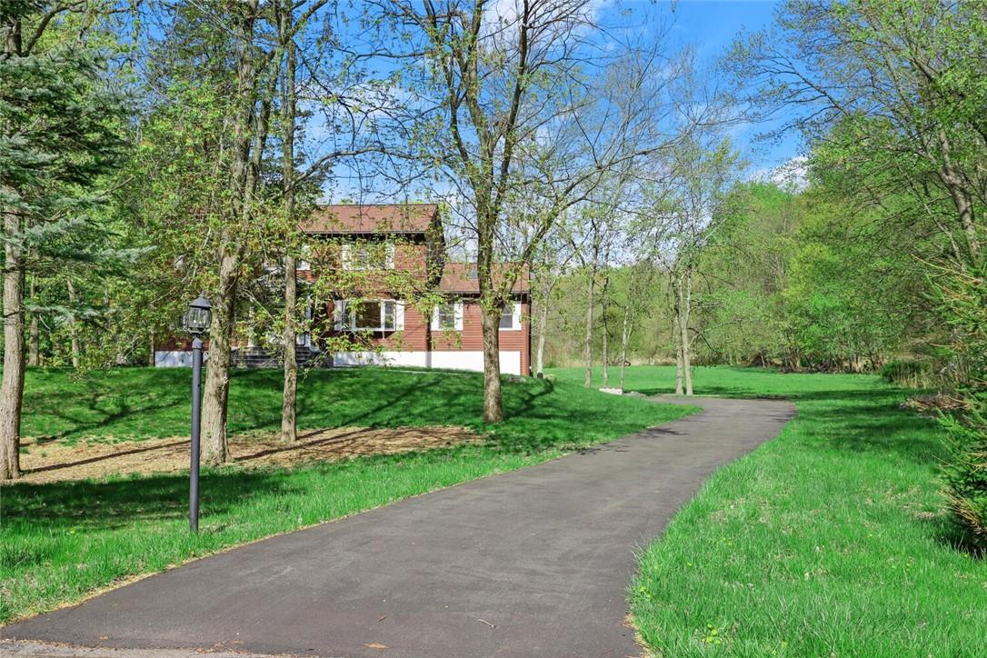 a view of a yard in front of house