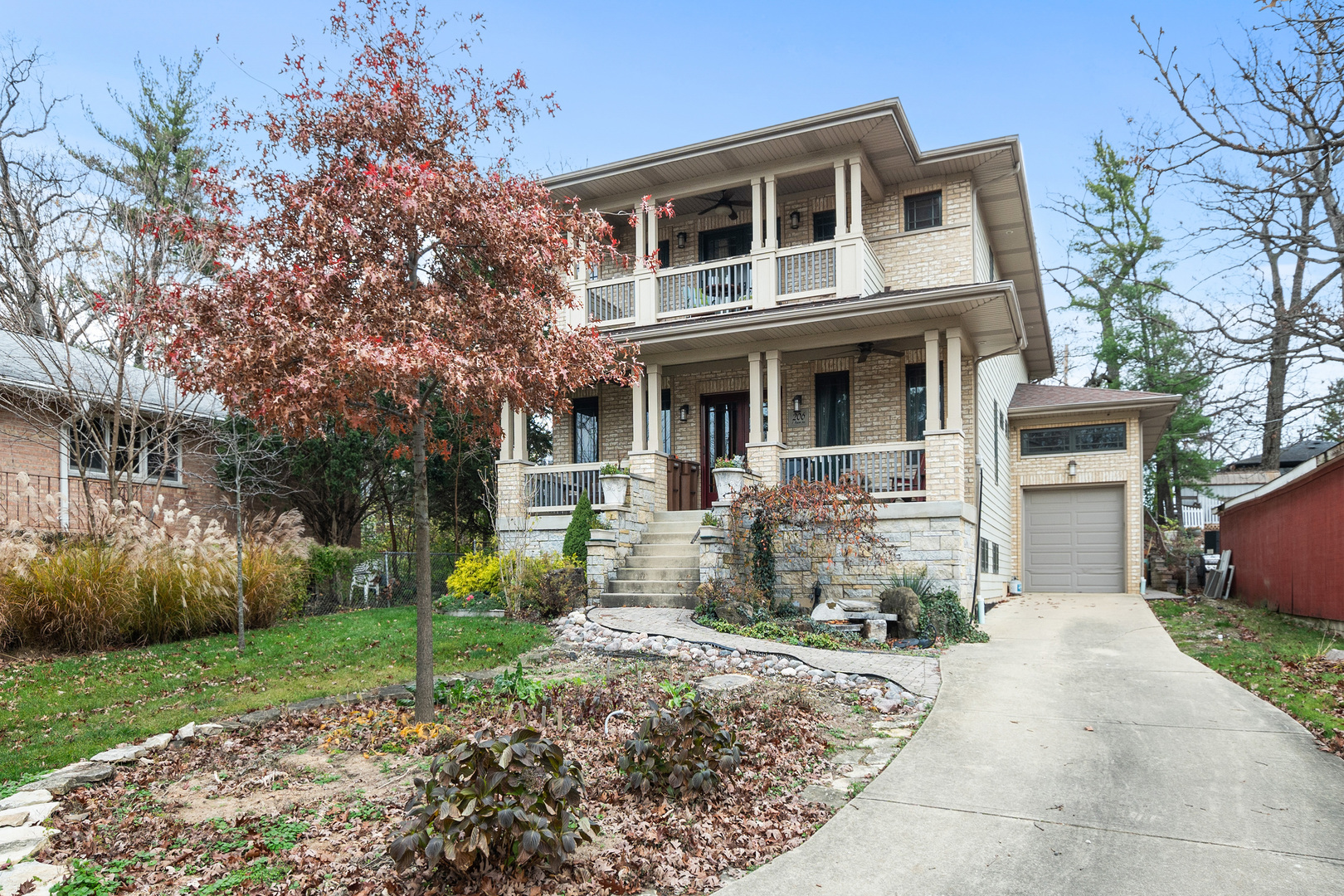 a front view of a house with garden