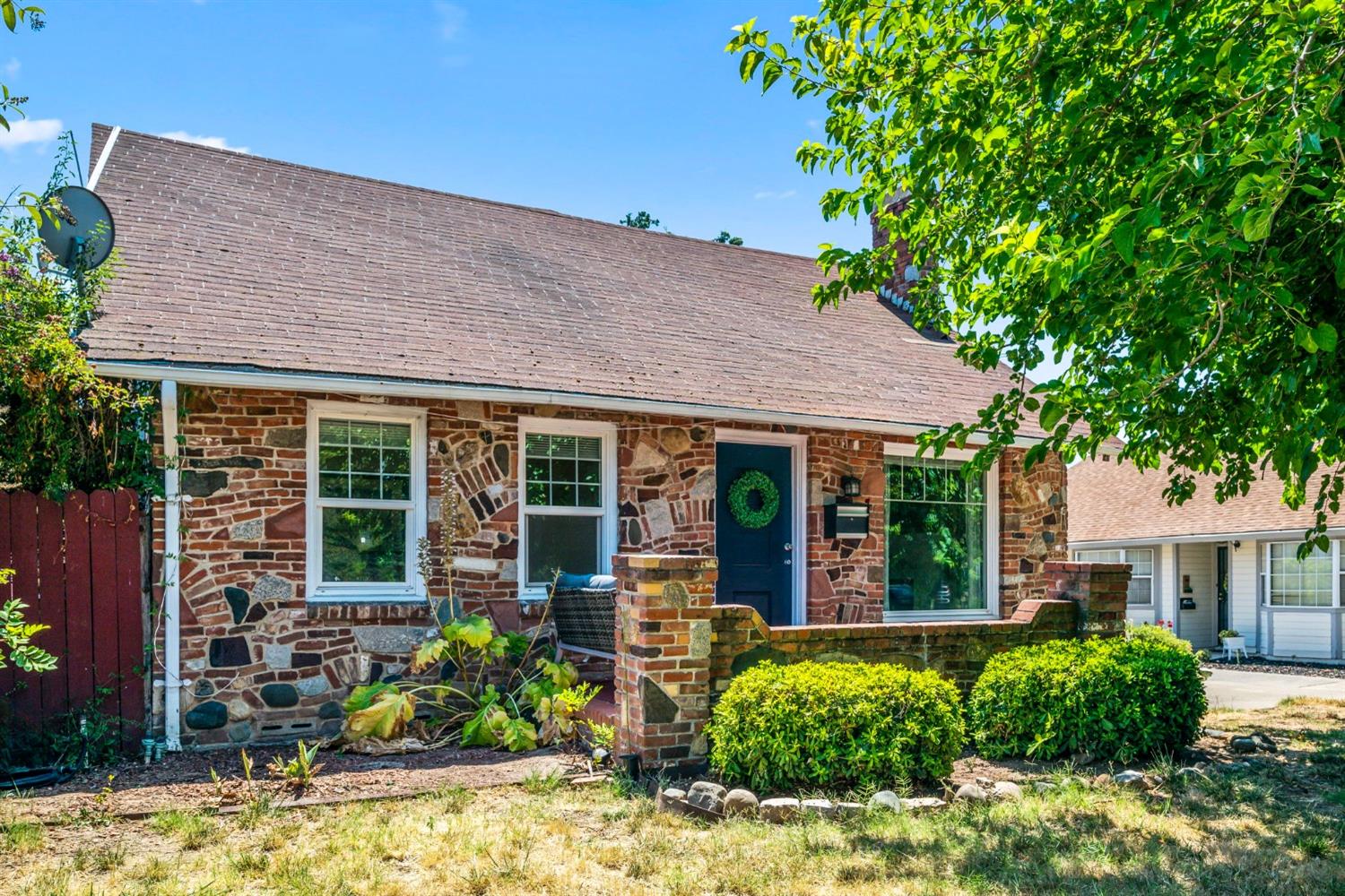 a front view of a house with garden