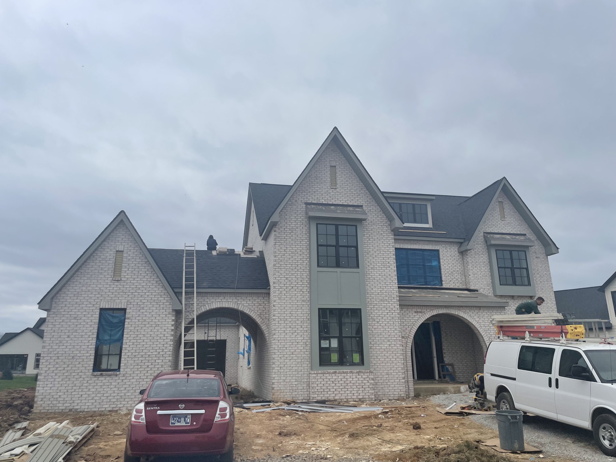 a front view of a house with parking space