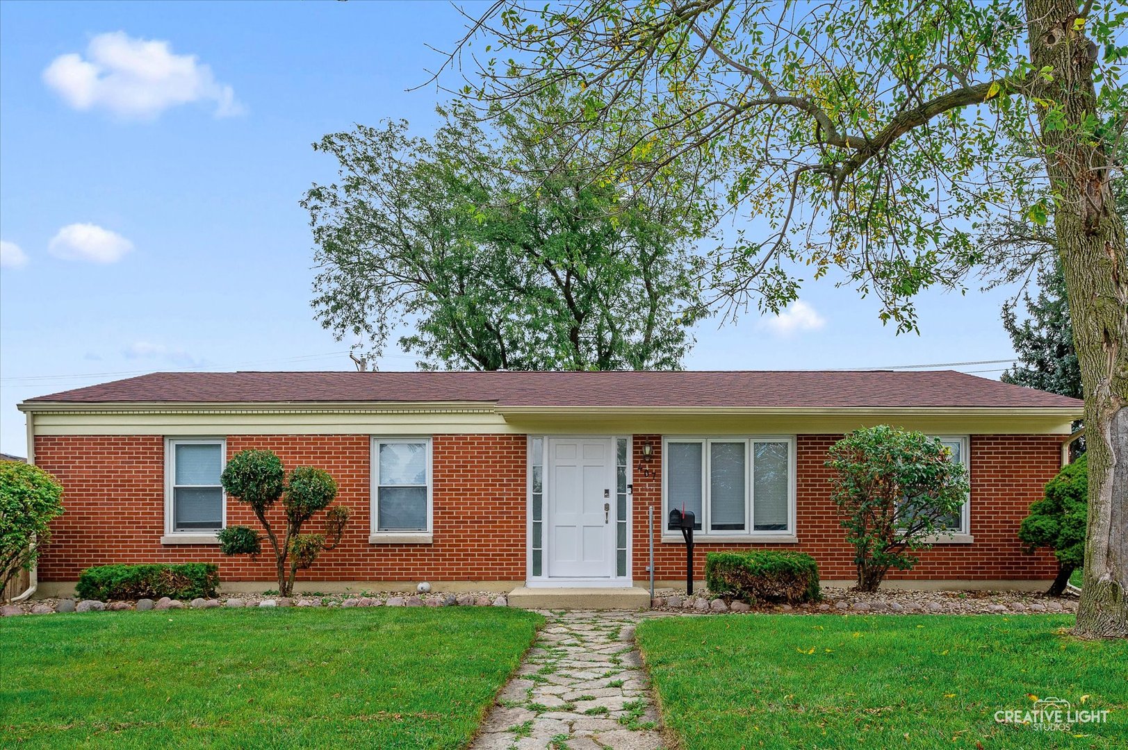 a front view of a house with garden