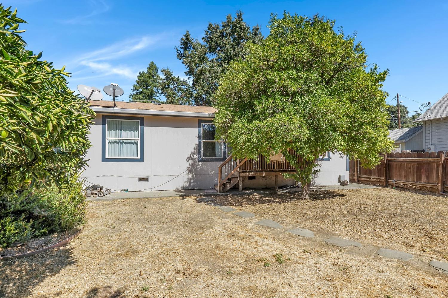 a view of a house with a yard and garage