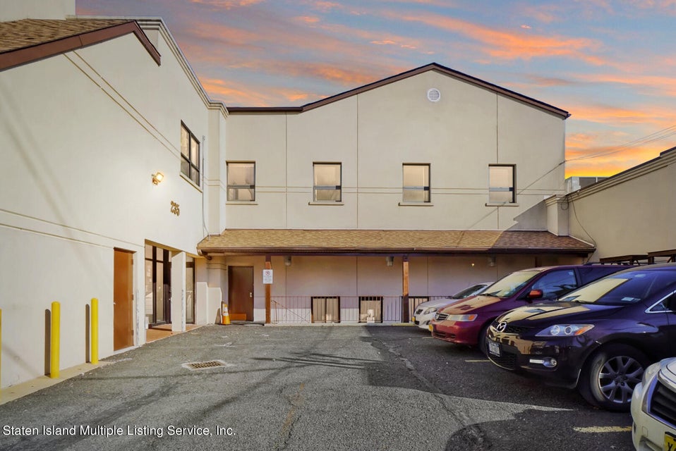 a front view of a house with parking space