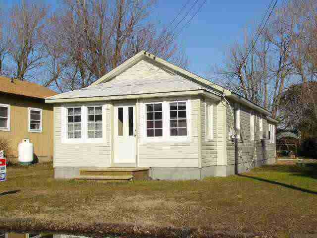 a front view of a house with yard