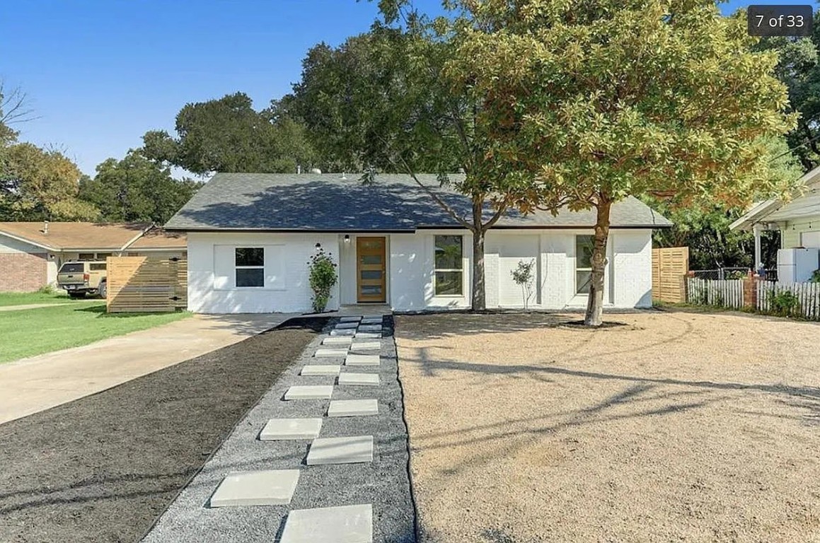 a house with trees in the background