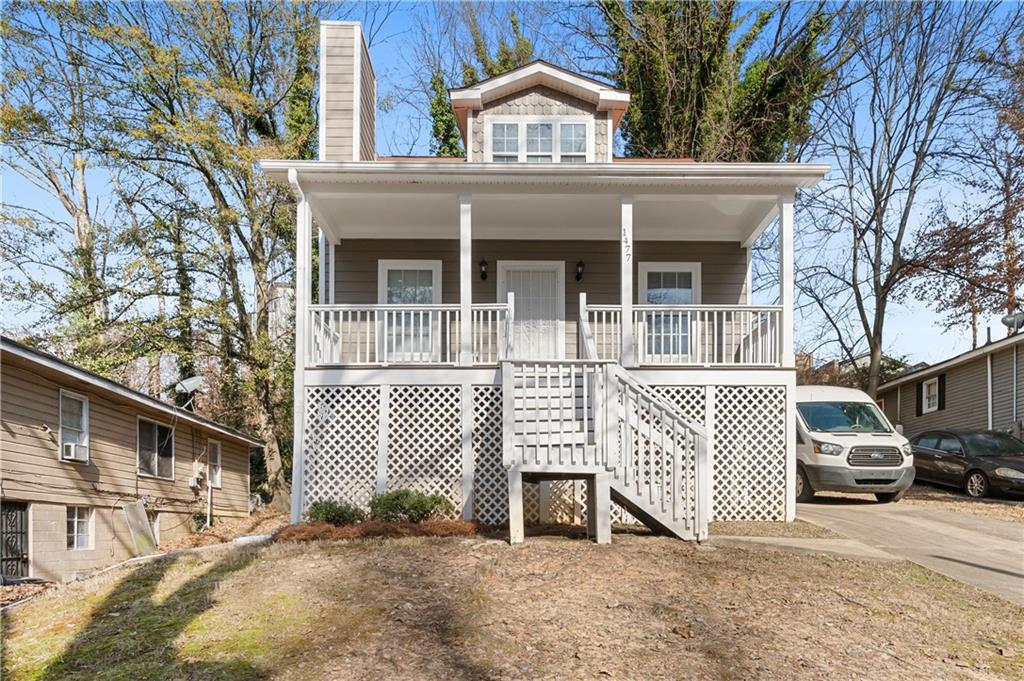 front view of a house with a bench